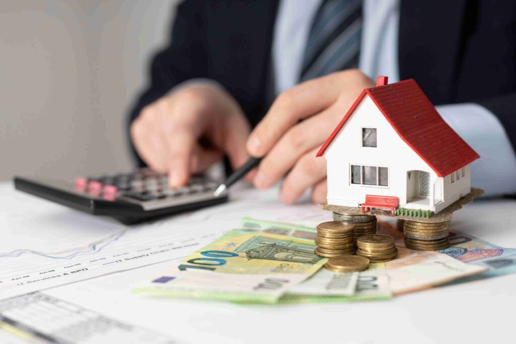 The True Cost of Owning a Home: What Your Mortgage Payment Does Not Show Homeowner reviewing the true cost of owning a home beyond the mortgage payment